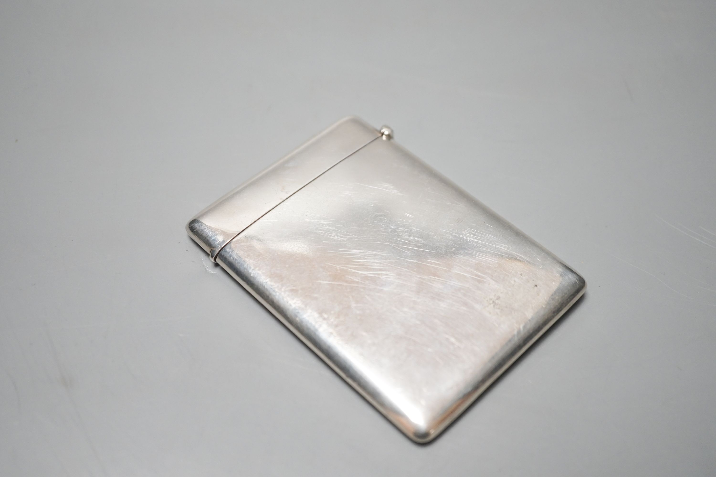 A George V silver card case embossed with mistletoe, Birmingham, 1911, 89mm.